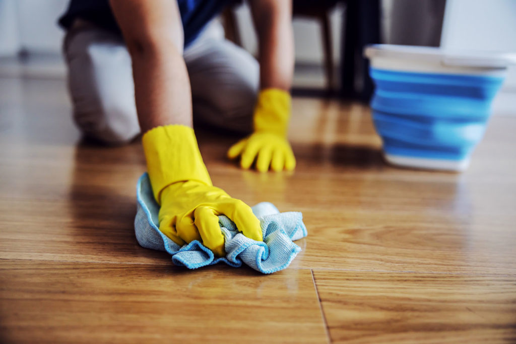 man waxing parquet hardwood floor 1024x683 1